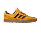 The JI0851 Mesa Black Gum Tyshawn 2 Adidas skateboarding shoe features mustard yellow suede and leather with black stripes, a brown sole, and black lining. Shown from the side on a white background.