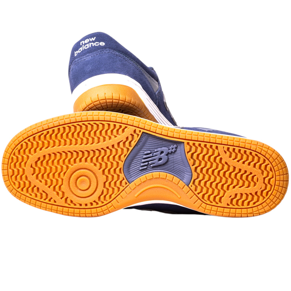 A close-up of the sole on the 480BEE Navy White New Balance Numeric Suede Skateboarding Shoes, showing a textured orange and blue pattern with FuelCell foam, the NB logo in the center, and "new balance" printed in white on the heel.