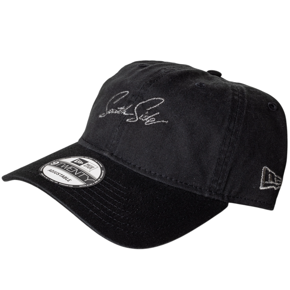 The Southside Pewter Script Strapback 920 Hat by New Era features white script embroidery on the front, a side New Era logo, and a curved brim with a "9TWENTY Adjustable" sticker.