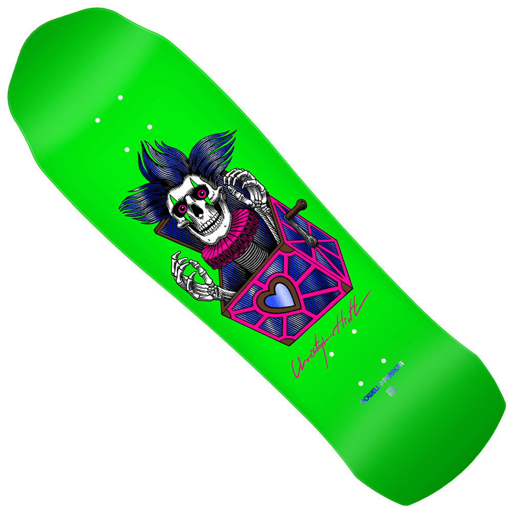 The Powell Peralta Deck Chris Hiett 9.5x32.1 Skull Pro Shaped features a vibrant green design with a cartoon skeleton in a suit, blue spiky hair, emerging jack-in-the-box style from a pink coffin, signed and logoed—Chris pro graphic x VCJ collaboration.