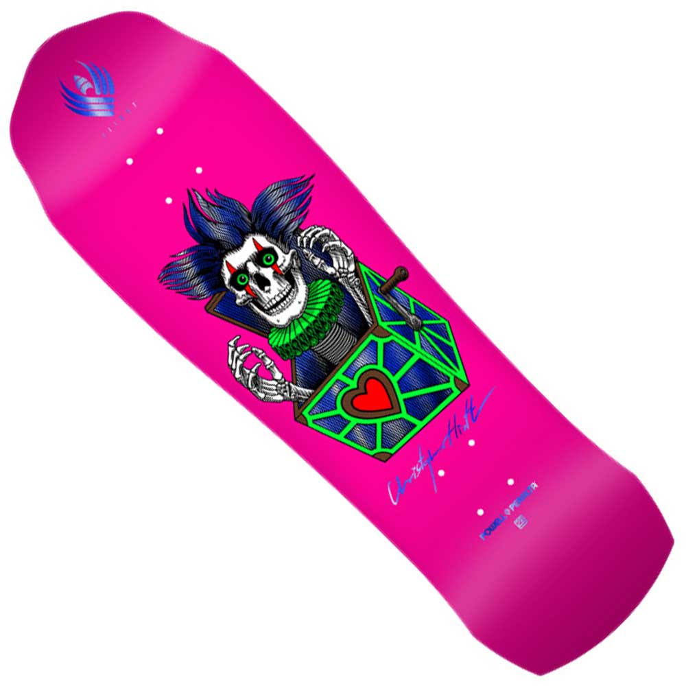 The Powell Peralta Flight Deck Chris Hiett 9.5x32.1 Skull Pro Shaped features a bright pink base and a cartoon skeleton with wild blue hair, red eyes, and a big grin bursting from a green-blue heart box, plus signature text on the lower right.