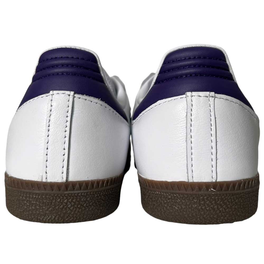 Back view of Purple White Samba ADV Adidas Skateboarding Leather Suede Shoes, featuring purple heel accents and brown textured rubber soles, displayed against a plain white background.