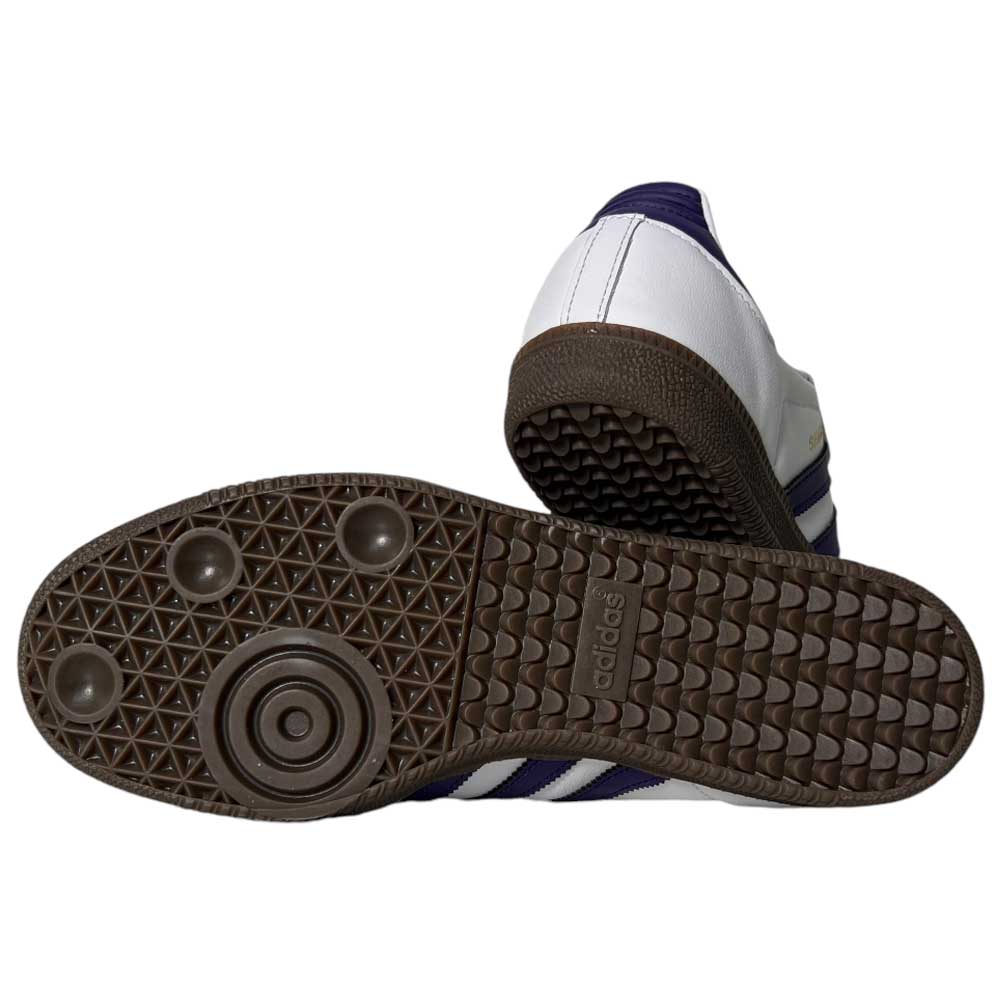 A pair of Purple White Samba ADV Adidas Skateboarding Leather Suede Shoes featuring a brown, textured rubber sole with circular and triangular patterns, and the Adidas logo visible on the sole.