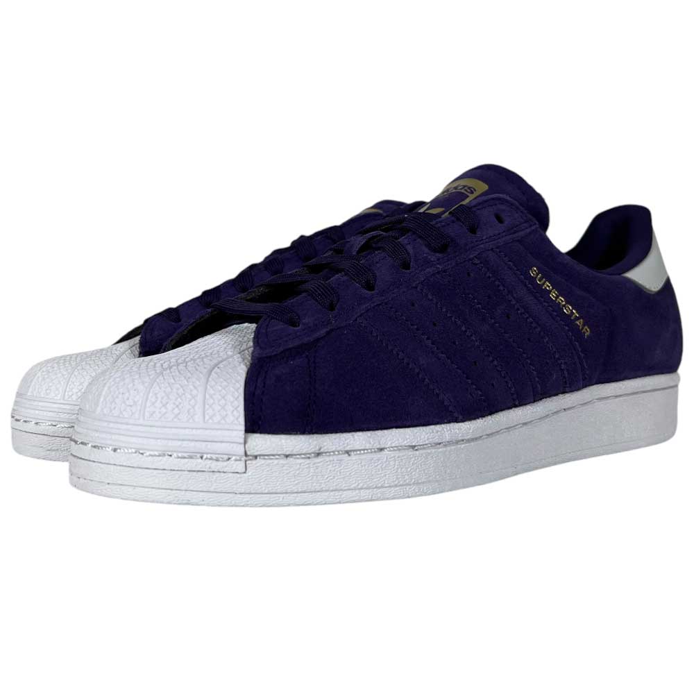 The Purple Zero Gold Superstar ADV Adidas Skateboarding Suede Shoes feature a bold purple suede upper, reflective badging, gold SUPERSTAR text, white shell toe caps, and midsoles—perfect for fans of classic skate style.