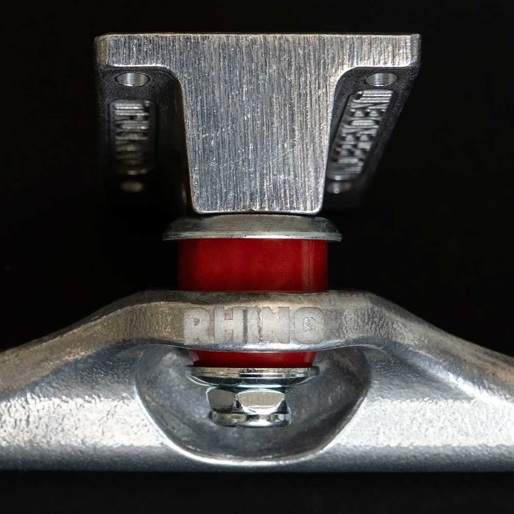 Close-up of a Rhino Span Polished Silver Standard INDY 169 Stage 11 Truck with a red bushing and "RHINO" engraved on metal, sold as a set of two, shown against a black background.