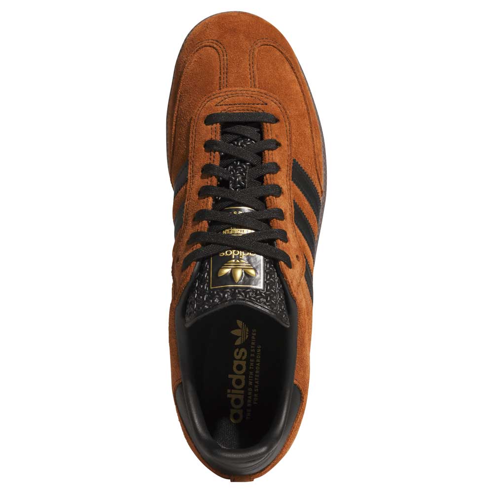 Top view of the Samba ADV Brown Black HQ9286 Adidas Skateboarding shoe in brown suede and leather, featuring black stripes, black laces, and gold logo details on the tongue and insole.