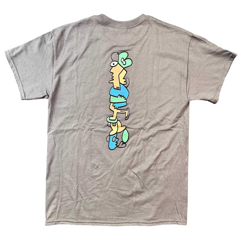 The Sebo Walker x Southside Skatepark Smoke Tee features a vertical cartoon graphic on the back with yellow, blue, and green abstract figures—perfect for Southside Skatepark fans.