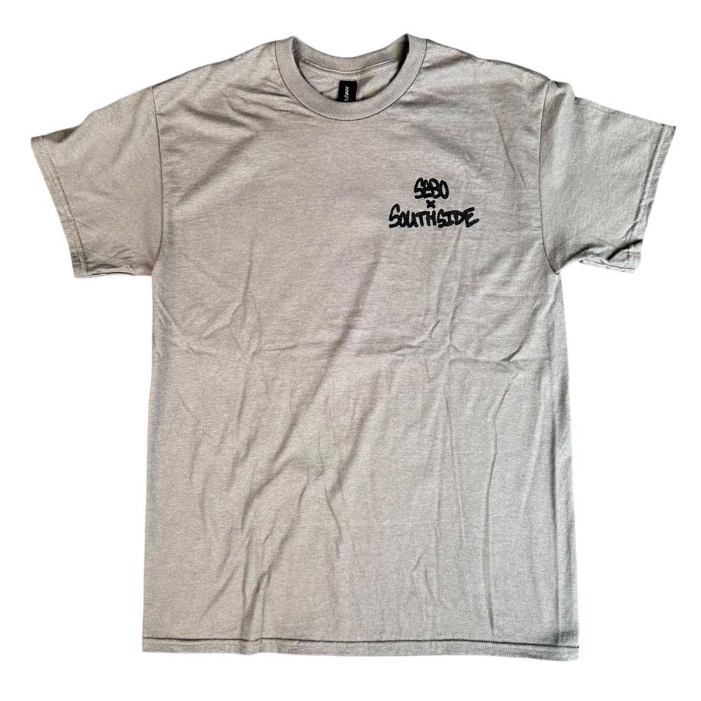 The Sebo Walker x Southside Skatepark Smoke Tee is a light gray short-sleeve shirt with "S620 Southside Skatepark" printed in black on the upper left chest, shown laid flat on a white background with a lightly wrinkled appearance.