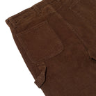 Close-up of Shmoo Carpenter Brown Corduroy Krooked Pant highlighting the waistband, back pockets, and fine vertical ribbed corduroy texture.