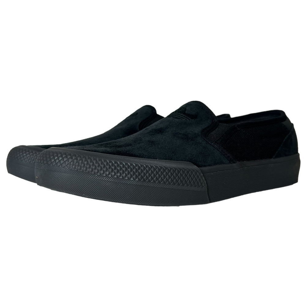The Shmoofoil Slip Adidas Skateboarding Core Black Carbon Suede Shoes feature textured rubber soles and a suede-like finish, displayed from a front-side angle against a white background.
