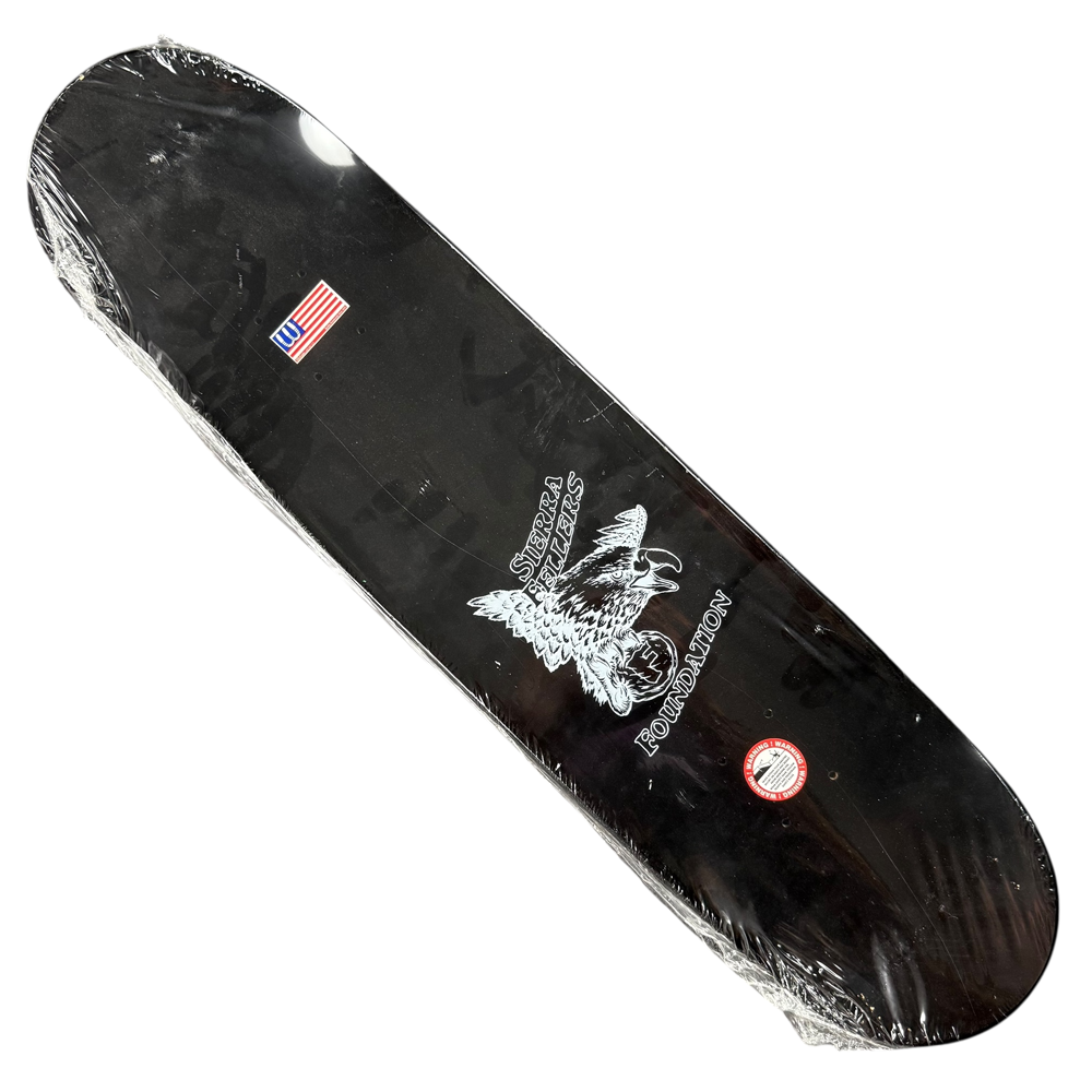 The Sierra Fellers Foundation 8x31.2 Black Dipped Autographed Collectible Skateboard Deck features a white eagle graphic, Skaters Lives Foundation text, and an American flag sticker—perfect for collectors and fans.