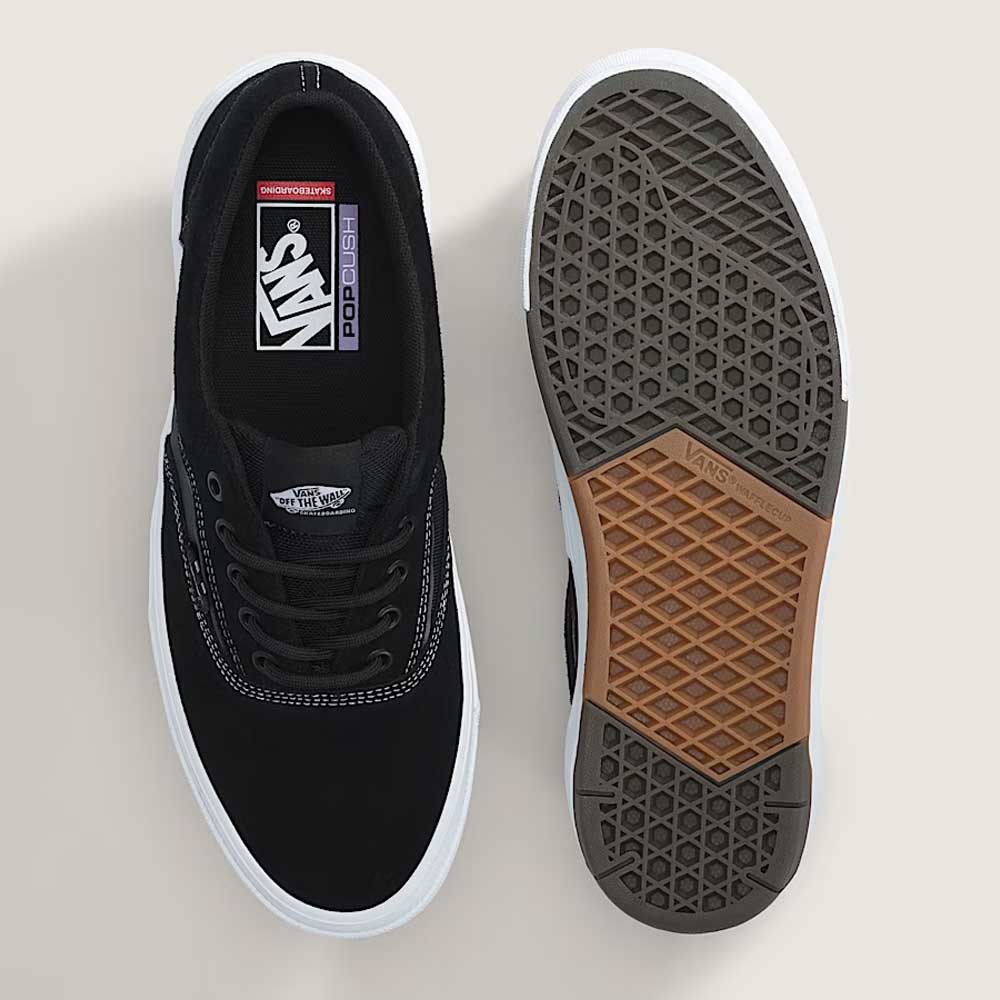 A pair of Vans Skate Era Wafflecup Black White VN000EF0BA21 suede rubber shoes—one shows the top with label and laces, the other highlights the brown and gray WaffleCup outsole with Vans logo, all on a light background.
