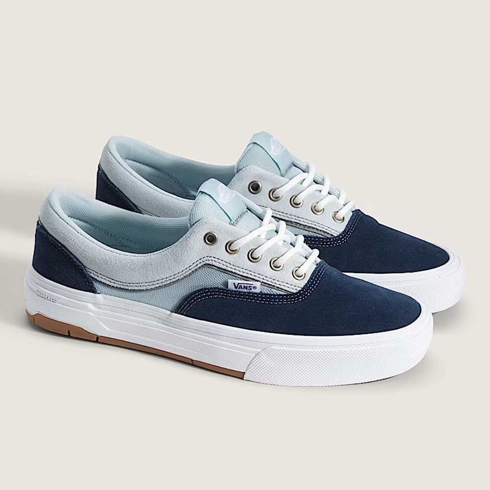 The Skate Era Wafflecup Navy Blue Bell VN000EF0J4I1 Vans Suede Rubber Shoes feature navy suede uppers, light gray fabric accents, white midsoles, and gum WaffleCup outsoles, displayed on a light background.