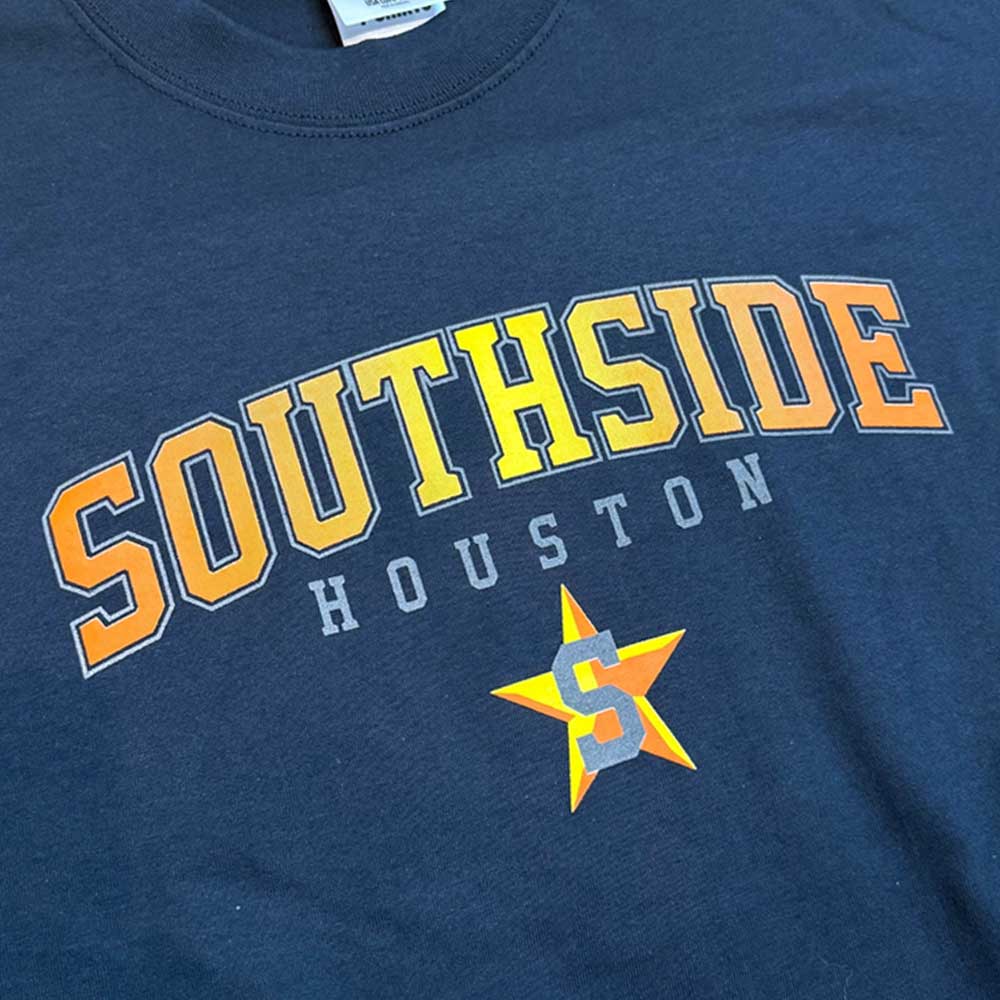 The Southside Tee Arching Navy Orange Yellow Reflective features premium USA cotton, SOUTHSIDE in bold yellow and orange, HOUSTON in white below, plus a standout yellow star with an S—your go-to streetwear fit.