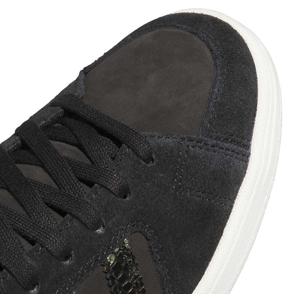 Close-up of the Superskate x Kader Shoes JQ4413 in core black/off white—Adidas Skateboarding sneakers with a leather and suede upper, black laces, and a white rubber sole for stylish board performance.