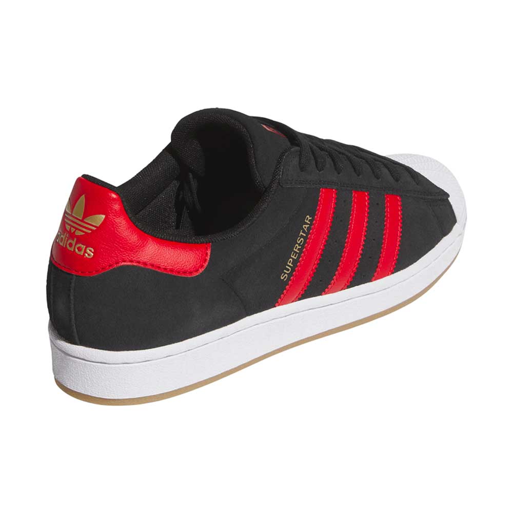The Superstar ADV Black Red KI5731 Adidas Skateboarding Suede Leather Shoes feature black suede, red stripes, a red heel tab with gold Adidas logo, white toe cap and sole—perfect skate sneakers—shown from the back left angle.