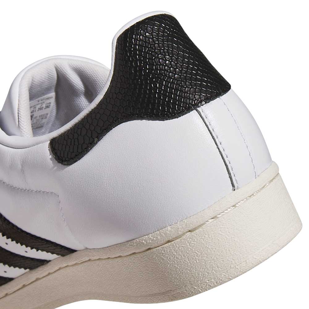 Close-up of the heel of the Superstar ADV White Black KI5727 Adidas Skateboarding Suede Leather Shoes, featuring a black textured patch, signature stripes, and detailed stitching—an iconic pick among adidas skateboarding styles.
