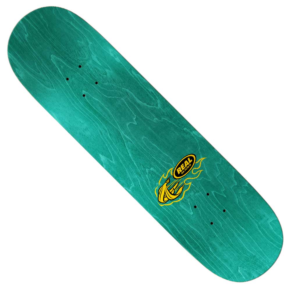 The Team Slick 8.25 Real Skateboards Deck is green with visible wood grain, pre-drilled truck holes, and a small yellow and black REAL logo accented by flame graphics near one end.