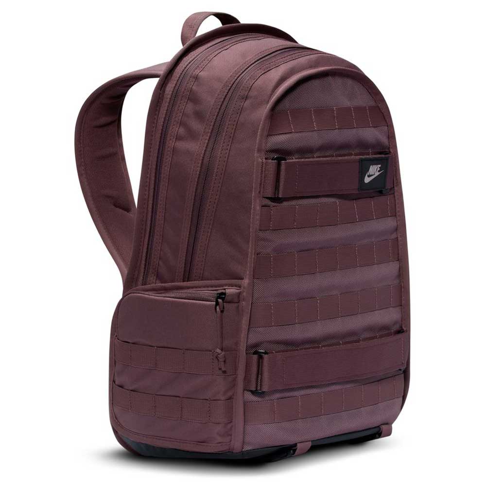 A Tattoo Black Light Violet Nike SB RPM Skate Backpack (FD7544-502) featuring padded shoulder straps, a front zip pocket, horizontal stitched loops, water-resistant material, and a small black Nike logo patch on the upper front.