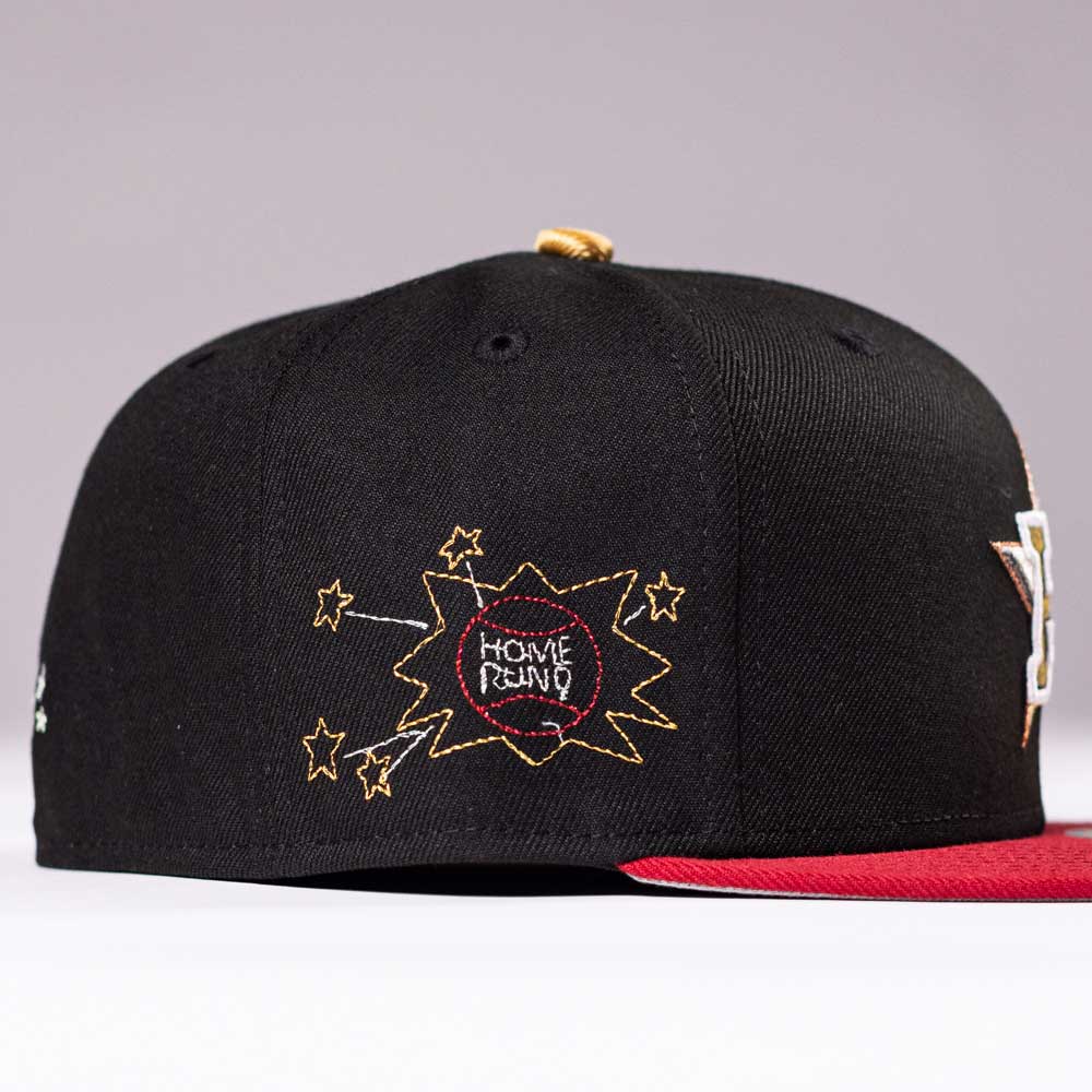 The Last Call New Era Hat 5950 Fitted NEW YEAR DROP features a black and red design with yellow star accents and HOME RUN! embroidered in a comic-style burst—available now, so grab yours before it’s gone!.