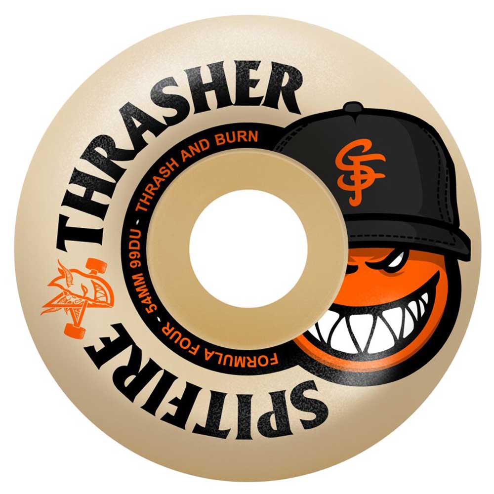 The Thrasher The City SF 54mm99A San Francisco Spitfire Wheel is beige with bold black THRASHER text, an orange grinning face wearing a black SF cap, and a small flaming logo on the left side.