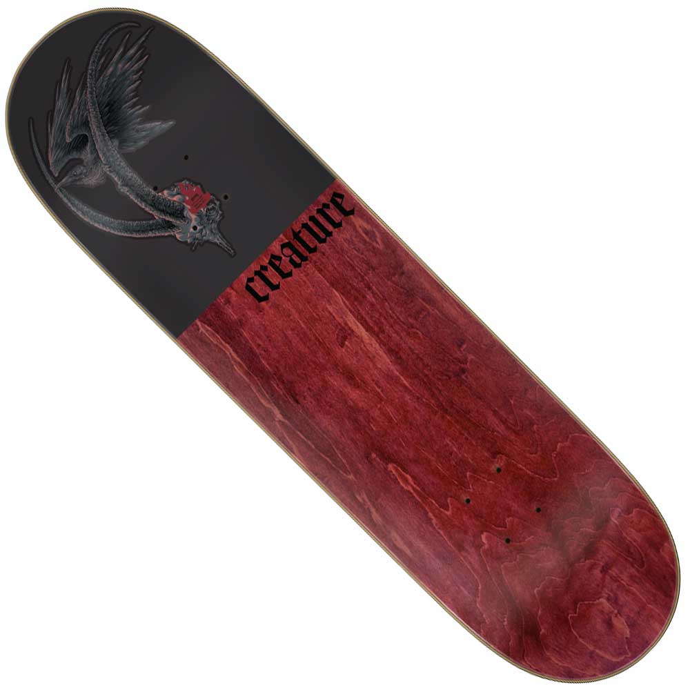 The Torres Guardian Pro Stumps 8.51in x 31.88in Creature Skateboard Deck is made from North American Maple and features a dark bird graphic holding a red heart on black and wood grain with bold black "Creature" text.