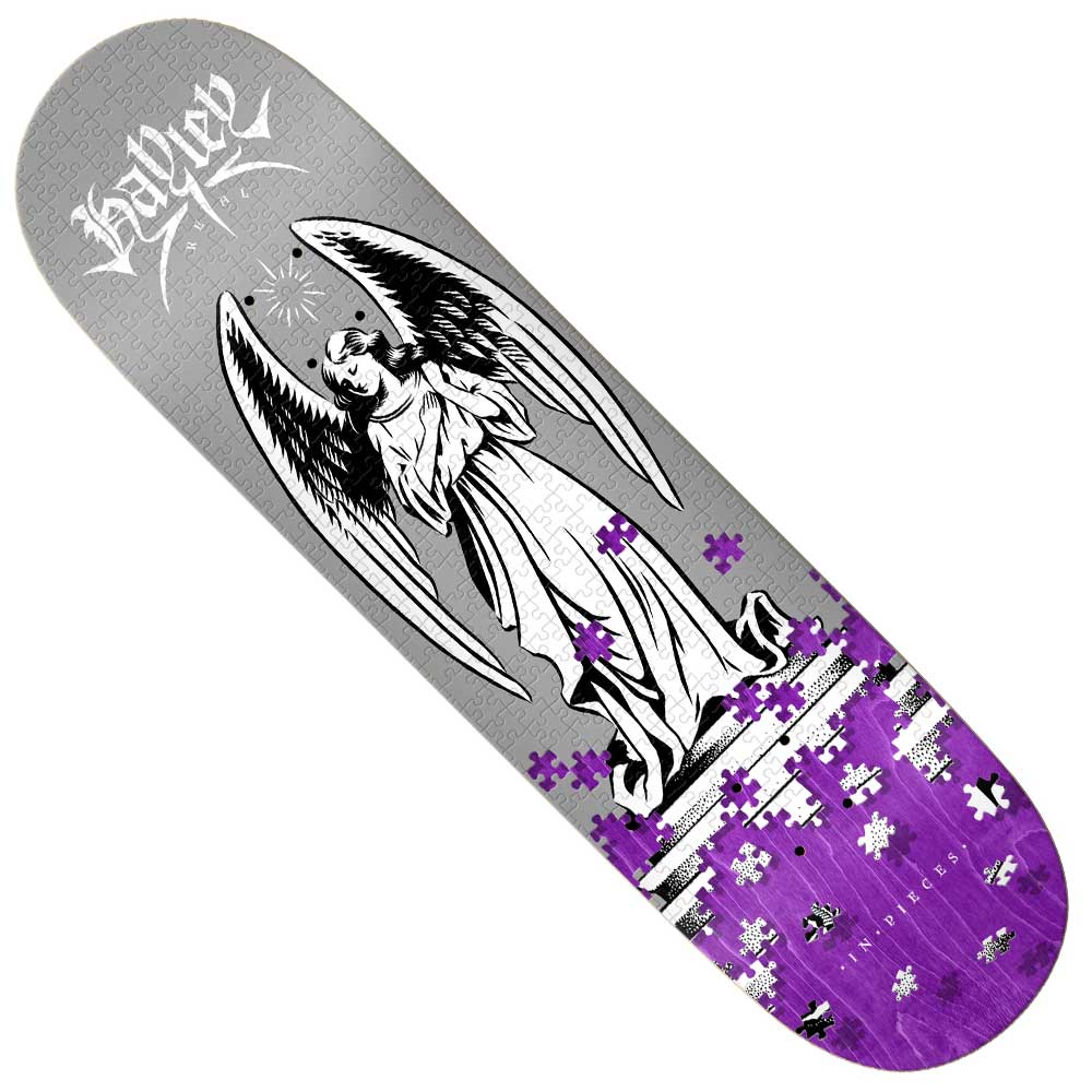 The True Fit In Pieces 8.25x31.5 Hayley Real Skateboard Deck features a black and white angel statue with clasped hands among purple and white puzzle pieces on a gray-to-purple gradient, created with the In Pieces organization for mental health support. SAYGE at top.