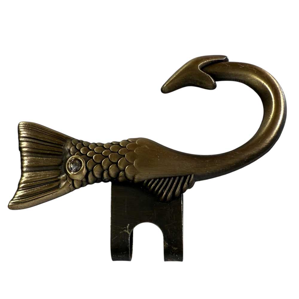 The Two Tone Metallic Hook Antique Gold Blip by Whatafitted features a fish tail shape with detailed scales, a fin on the left, an antique gold blip finish, and a hook opening at the bottom.