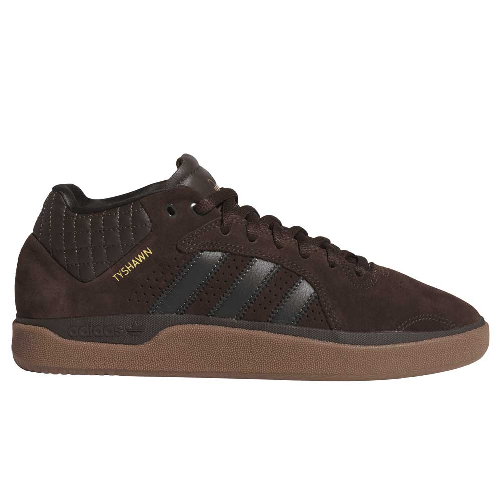 The Tyshawn HQ4740 Brown Gum Adidas skateboarding shoes feature a suede upper, black stripes, gum sole, quilted collar stitching, and TYSHAWN in gold on the side.