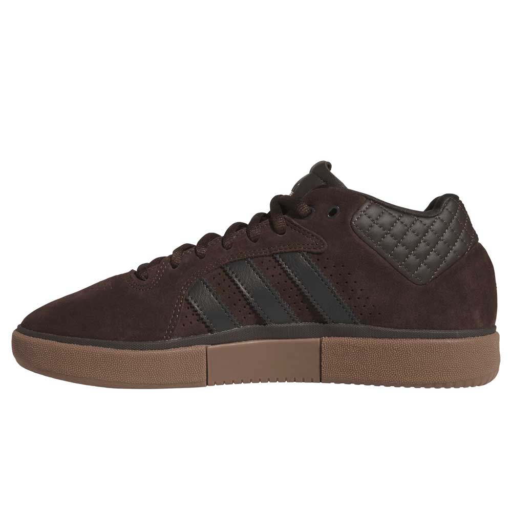 The Tyshawn HQ4740 Brown Gum Adidas Skateboarding Shoes feature a brown suede upper, black side stripes, brown laces, quilted heel detail, and a durable gum sole—ideal for skaters seeking both style and performance.