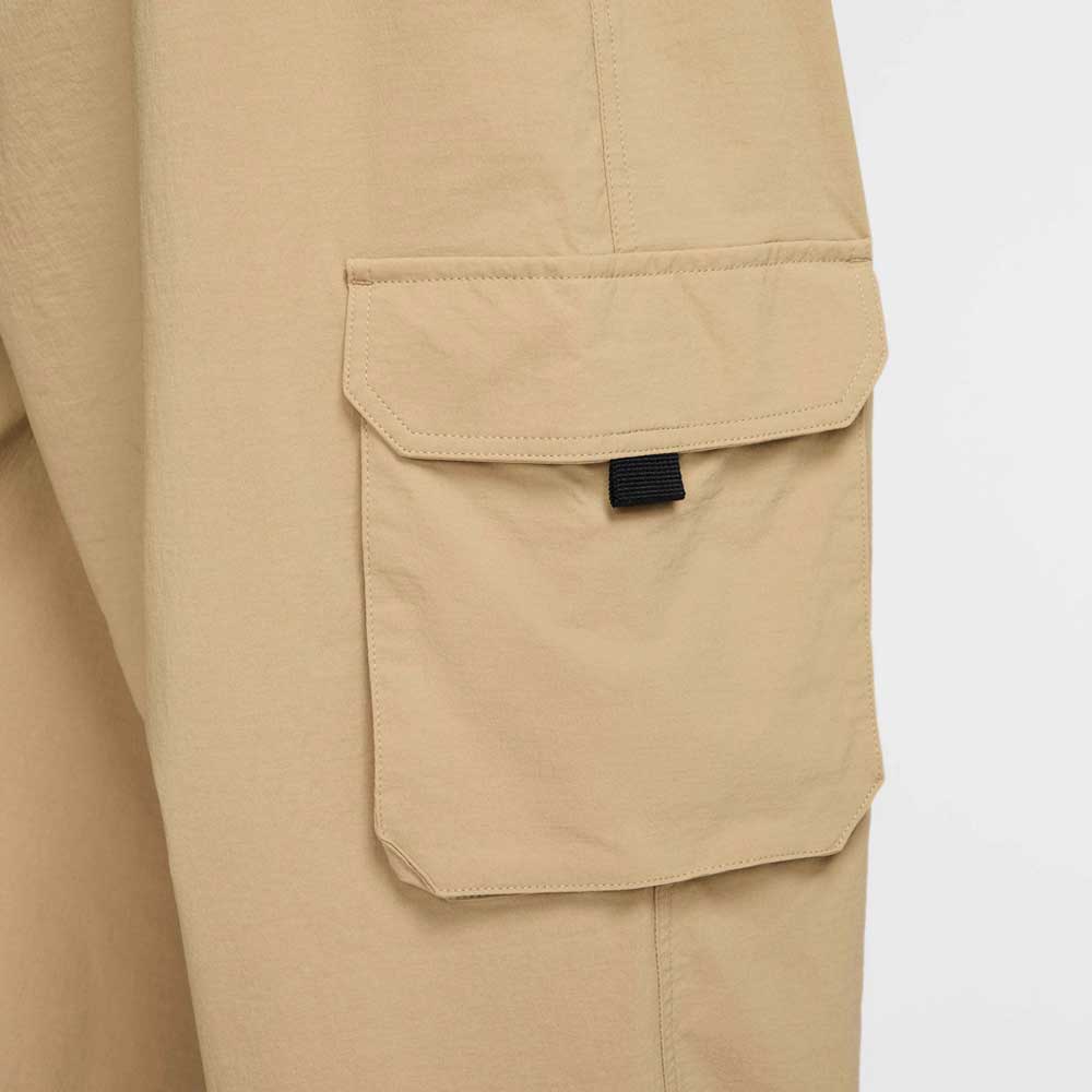Close-up of the FV7347297 Kearny Cargo Pant Khaki—Nike SB Skate Dri Fit—featuring a pocket with flap, black tab, and detailed stitching, ideal for those wanting durable khaki skate pants.