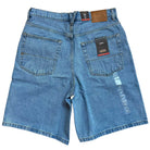 The VN000C9VCDX1 Skate Check 5 Loose Shorts in stonewash blue denim from Vans feature a heavyweight build, two large back pockets, and tags by the waistband and pocket—delivering classic, casual style ideal for skateboarding.