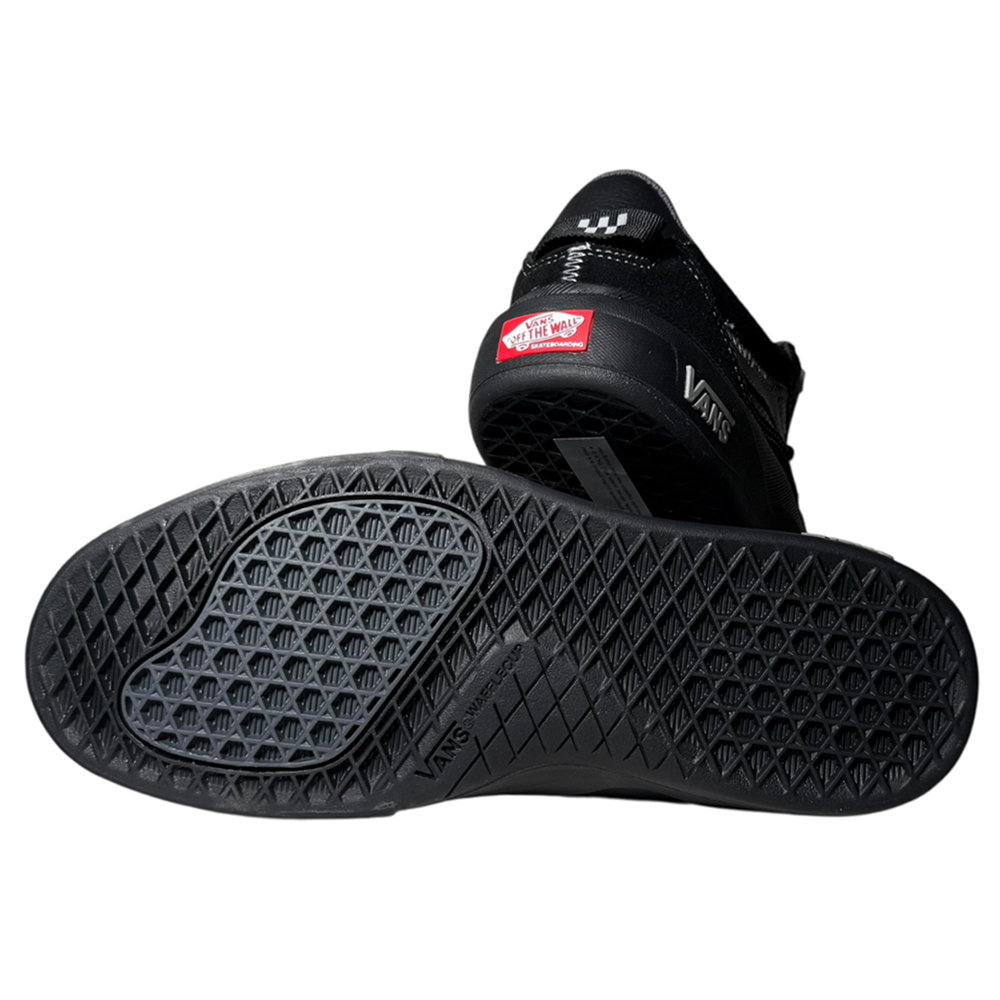 A pair of VN000D5D1741 Wayvee Skate 2 Black Black Grey Vans suede shoes—one on its side showing the waffle sole, the other upright with the red Off The Wall logo—classic durable skate shoes engineered for impact cushioning.