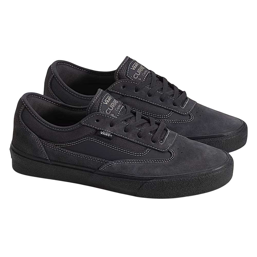 The VN000D85CC81 Skate Curren Caples Charcoal Black Vans Suede Rubber Shoes, featuring black laces, white stitching, Popcush insoles for comfort, and visible Vans logos on the side and tongue, are shown side by side on a white background.