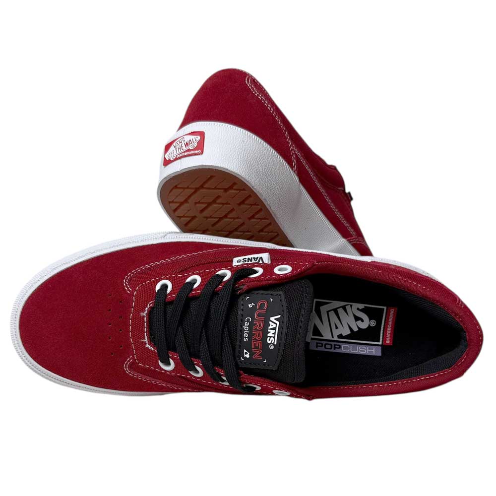 A pair of VN000D85Y521 Skate Curren Caples Red White Vans suede and rubber shoes. One is upright, showing the PopCush insole and laces; the other rests on its side, revealing the white sole and Vans heel logo.