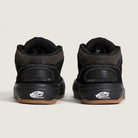 A pair of VN000D9ZKOU Black Asphalt Suede Skate Wafflecup Half Cab Vans shoes, shown from the back with Off The Wall logos on the heels and brown Wafflecup rubber soles, set against a plain light background.