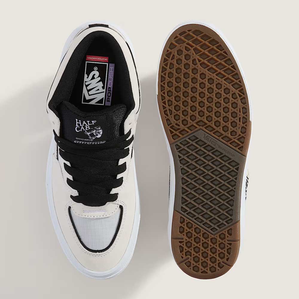 Top and bottom views of the VN000D9ZYB2 White Black Suede Skate Wafflecup Half Cab Vans Shoes, featuring black laces and branding on top, with a brown rubber Wafflecup tread pattern on the sole.