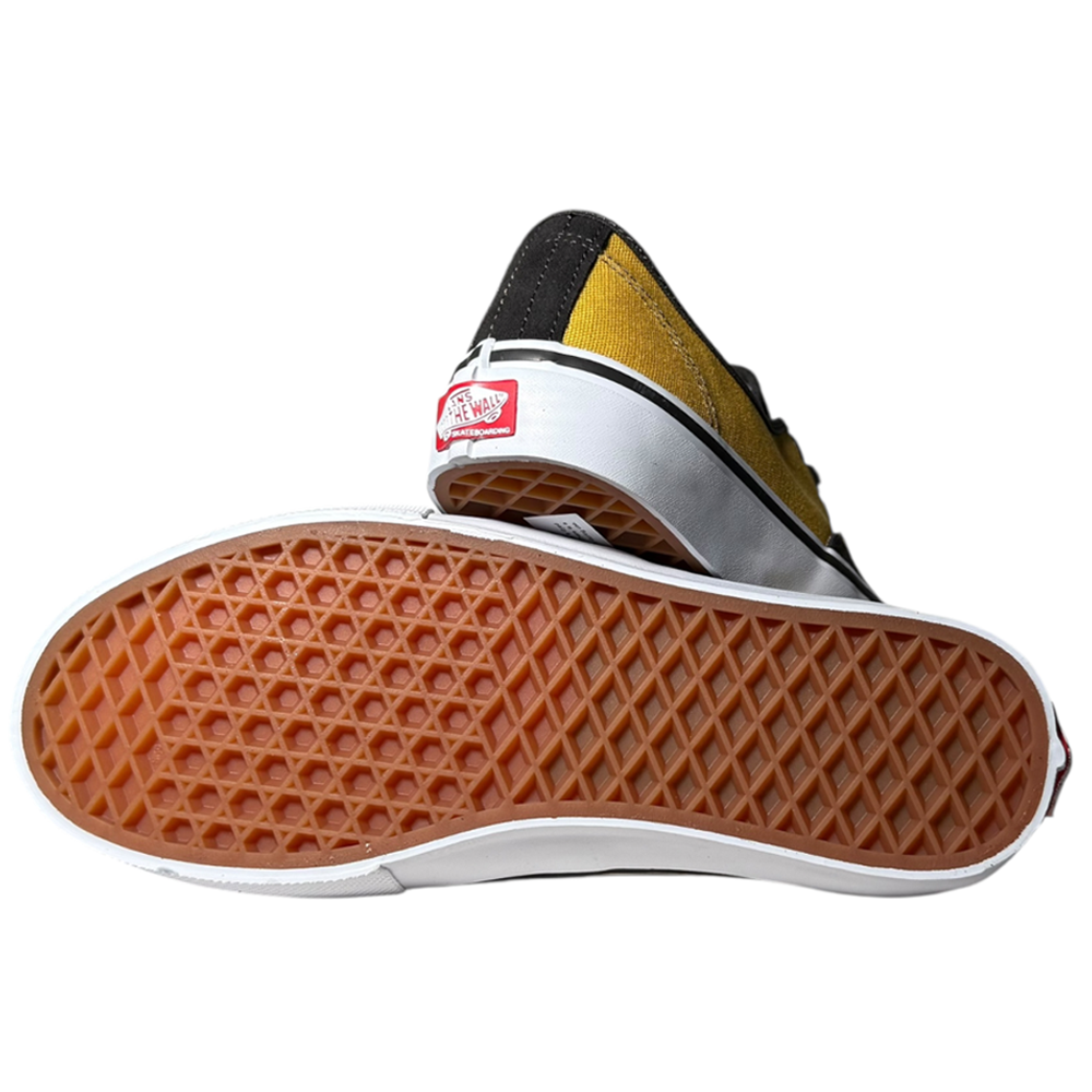 The VN000EERBLN Fade Brown Mustard Authentic Vans Skate Suede Shoes feature yellow and black suede uppers, classic brown waffle-patterned soles, PopCush footbeds, and a red Vans logo on the heel. One shoe stands upright; the other lies on its side.