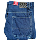 The VN000KXMAHU Skate Check 5 Loose Vintage Indigo Denim Vans Pant features heavyweight denim, a large back pocket, red Vans label, and a black-and-gray checkerboard waistband patch—classic skateboarding style.