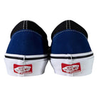 Rear view of VN0A2Z31Y40 Sport Blue Black Skate Slip On Vans Suede Shoes with blue/black uppers, white midsoles, and red Off The Wall heel logos. Classic style and comfort ideal for skate shoe fans.