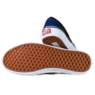 A pair of VN0A2Z31Y40 Sport Blue Black Skate Slip On Vans Suede Shoes, featuring one shoe’s waffle-patterned brown sole and the other’s red Vans Off The Wall heel logo.
