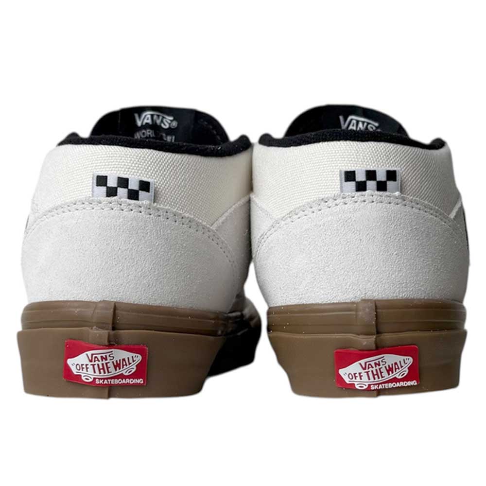 Seen from the rear, the VN0A2Z348YG Antique White Gum Suede Skate Half Cab Vans Shoes feature white suede uppers, brown gum soles, black trim, checkerboard heel detail, and the red Vans Off The Wall Skateboarding logo on the back.