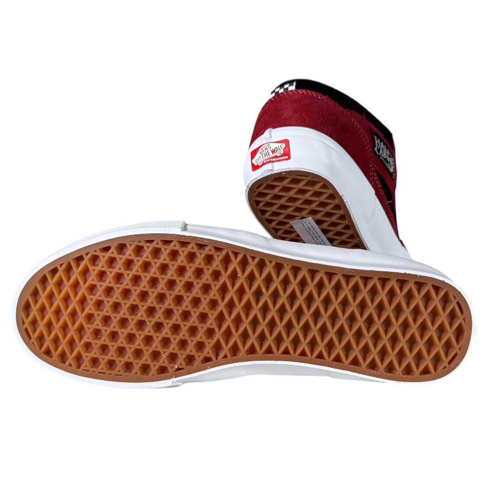 A pair of VN0A2Z34REB Sport Red Black Suede Skate Half Cab Vans Shoes: one upright showing the heel logo, the other on its side displaying the brown waffle-patterned sole—classic, durable Vans for street style.