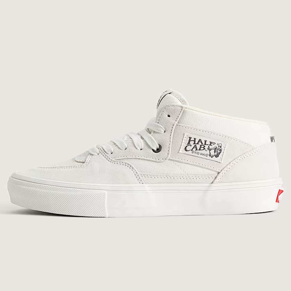 The Vans Skate Half Cab Marshmallow White VN0A5FCDCA Suede Skateboard Shoes feature a white mid-top design with a white sole, white laces, PopCush impact protection, and a Half Cab logo patch on the side.