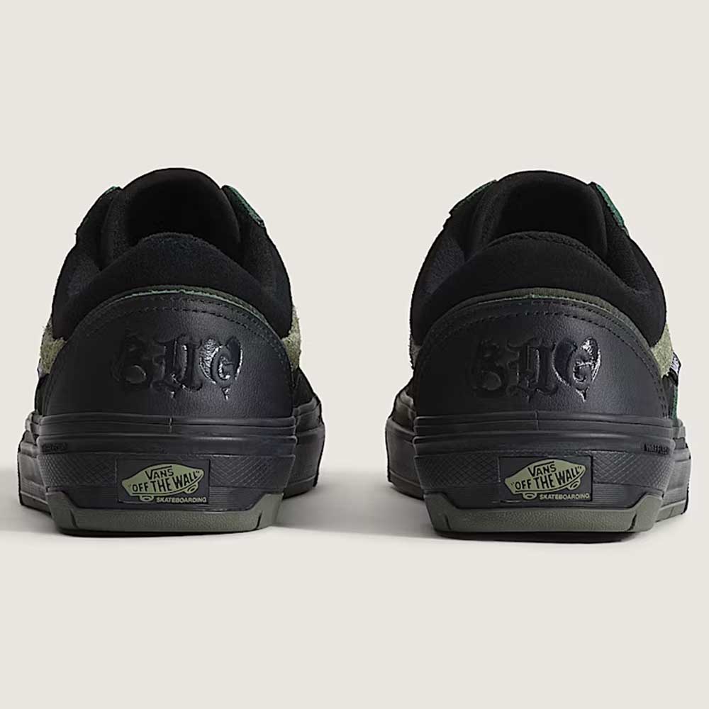 Rear view of Vans Skate Half Cab Walnut Gum VN0A5FCD77J1 suede skateboard shoes with green accents, SUP and EME embossed on the heels, PopCush impact protection for comfort, and Vans Off The Wall logo on the sole.