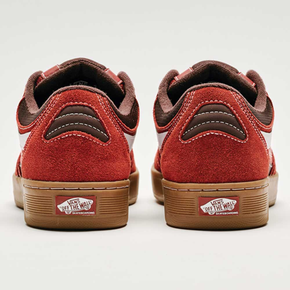 The Vans Skate Rowan Z3 VN000V74BRD Gum Bordeaux Suede Skateboard Shoes feature red uppers, brown suede accents, gum soles, and display the Vans Off The Wall logo on the heel tabs for superior impact protection.