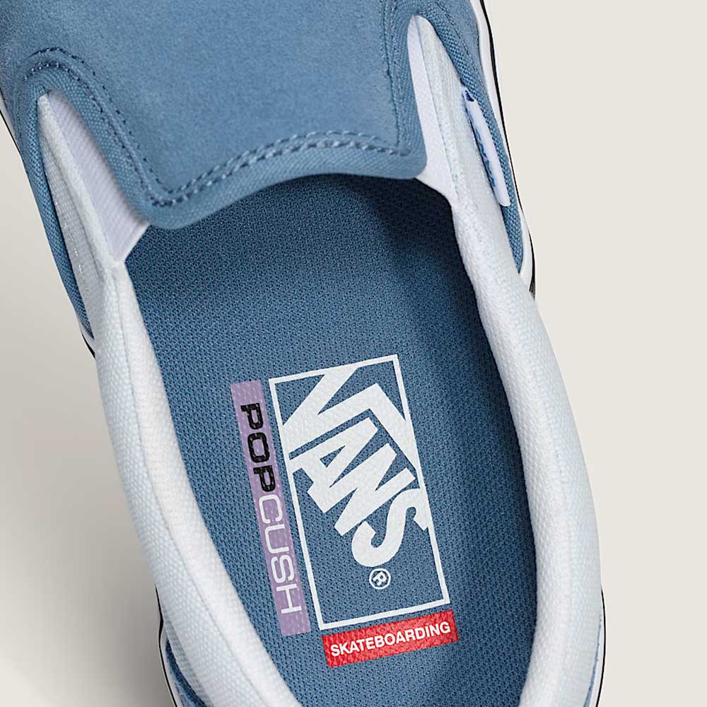Close-up of the inside of the Vans Skate Slip On VN000EG5DSB1 Dusty Blue Suede shoe, showcasing the Vans, PopCush, and Skateboarding logos on the insole—emphasizing its skateboarding performance features.