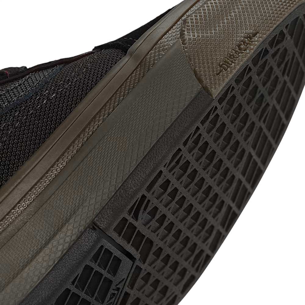 Close-up of the Vans Wafflecup Old Skool Black Dark Gum VN000EB739L1 Suede Skate Shoes, showing the sole and side with Wafflecup construction, a diamond grid-patterned rubber outsole, and DURACAP embossed near the edge.