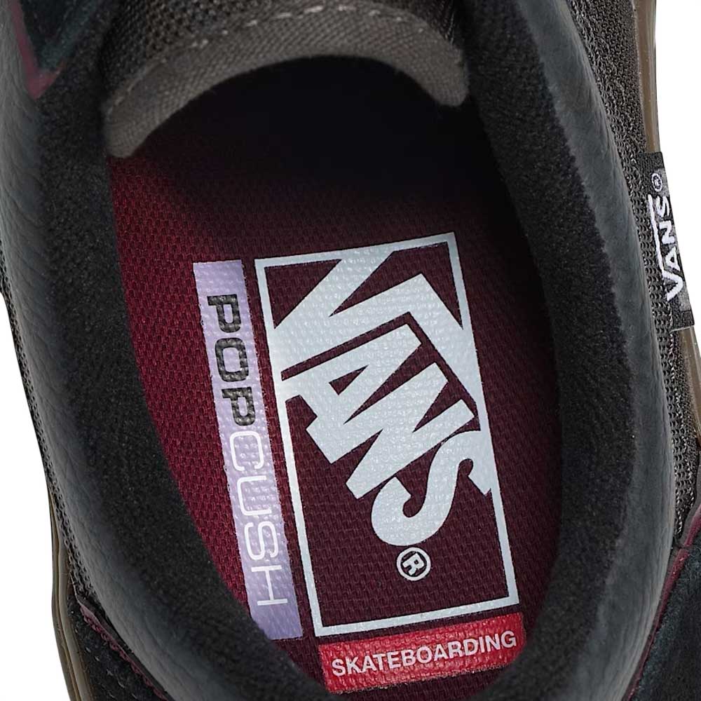 Close-up of the Vans Wafflecup Old Skool Black Dark Gum VN000EB739L1 Suede Skate Shoes' maroon insole with white Vans and PopCush branding, plus a small Skateboarding label.