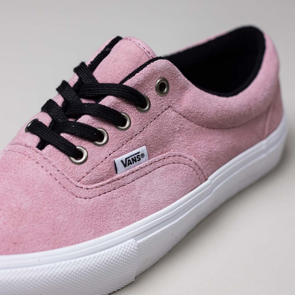 A close-up of the Vans Skate Era Mauve Mist VN000ECRZSB Suede Rubber Shoes, featuring pink suede, black laces, silver eyelets, a white rubber sole for traction, and a Vans logo tag on the side.
